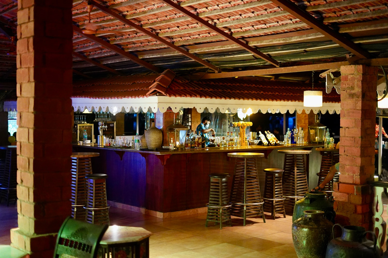 brown wooden bar stools and table