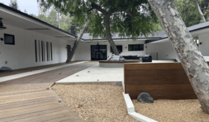 Patio with wood walk ways and rock accents, a seating area
